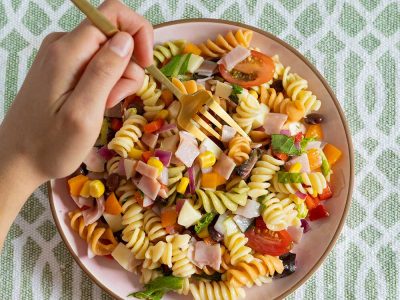 italian-pasta-salad-with-hand-and-fork